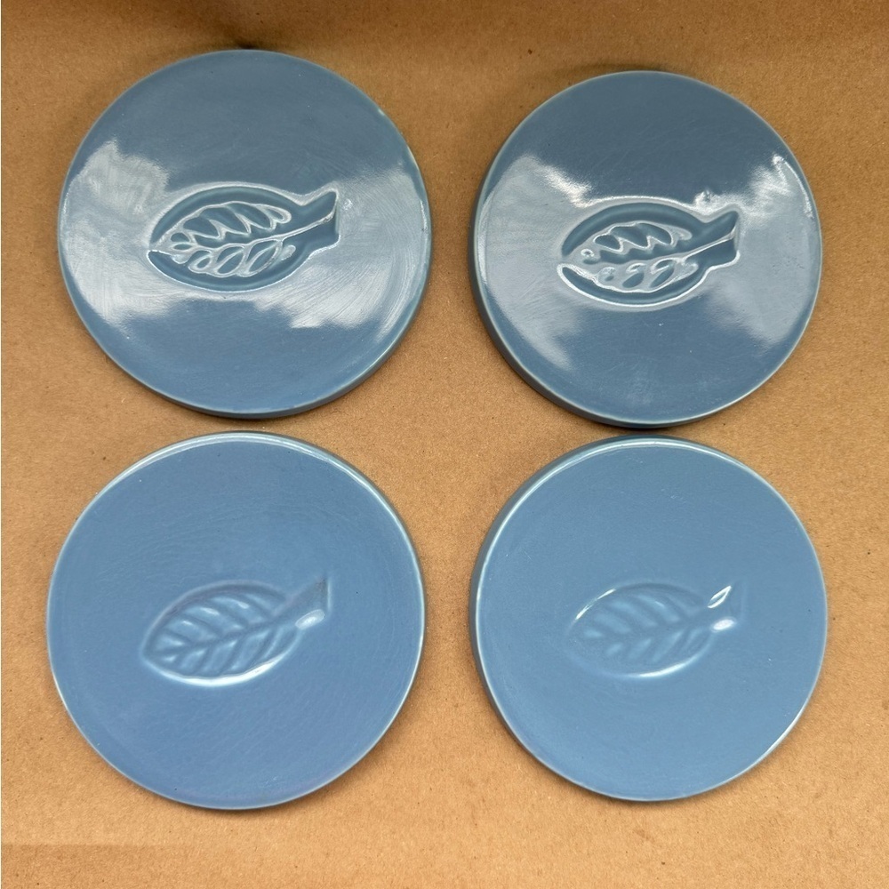 Set of 4 Blue Ceramic Coasters with Leaf Design. 4.5” diameter.